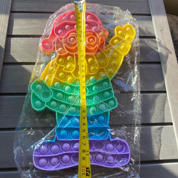 xlarge pastel colored Santa Christmas fidget pop toy 12x7 - Picture 2 of 3